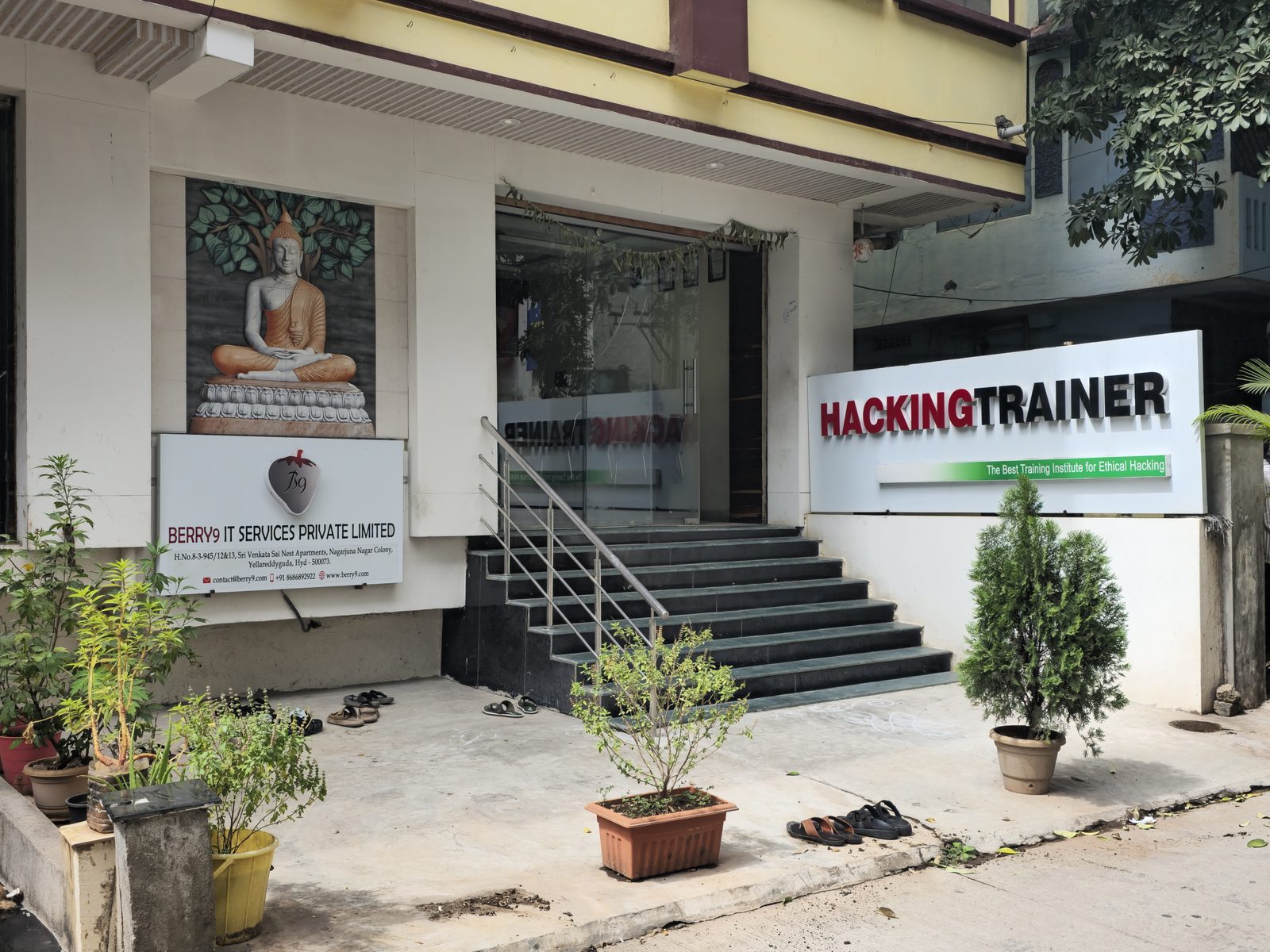 The ground-floor entrance in Ameerpet, with the Hacking Trainer signboard and the signboard of its parent company, BERRY9 IT Services Private Limited